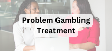 Two people sitting together and talking while looking at a laptop, with the text "Problem Gambling Treatment" displayed. 